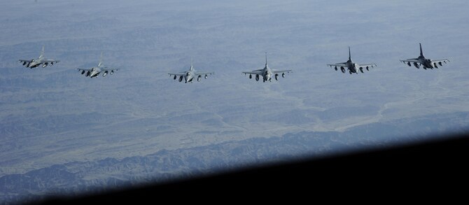 Six F-16 Fighting Falcons fly in formation after refueling from a KC-135 Stratotanker Oct. 28, 2016. The air refueling was observed by Airmen from the 379th Air Expeditionary Wing who took part in an orientation flight on the KC-135. (U.S. Air Force Photo by Senior Airman Cynthia A. Innocenti)
