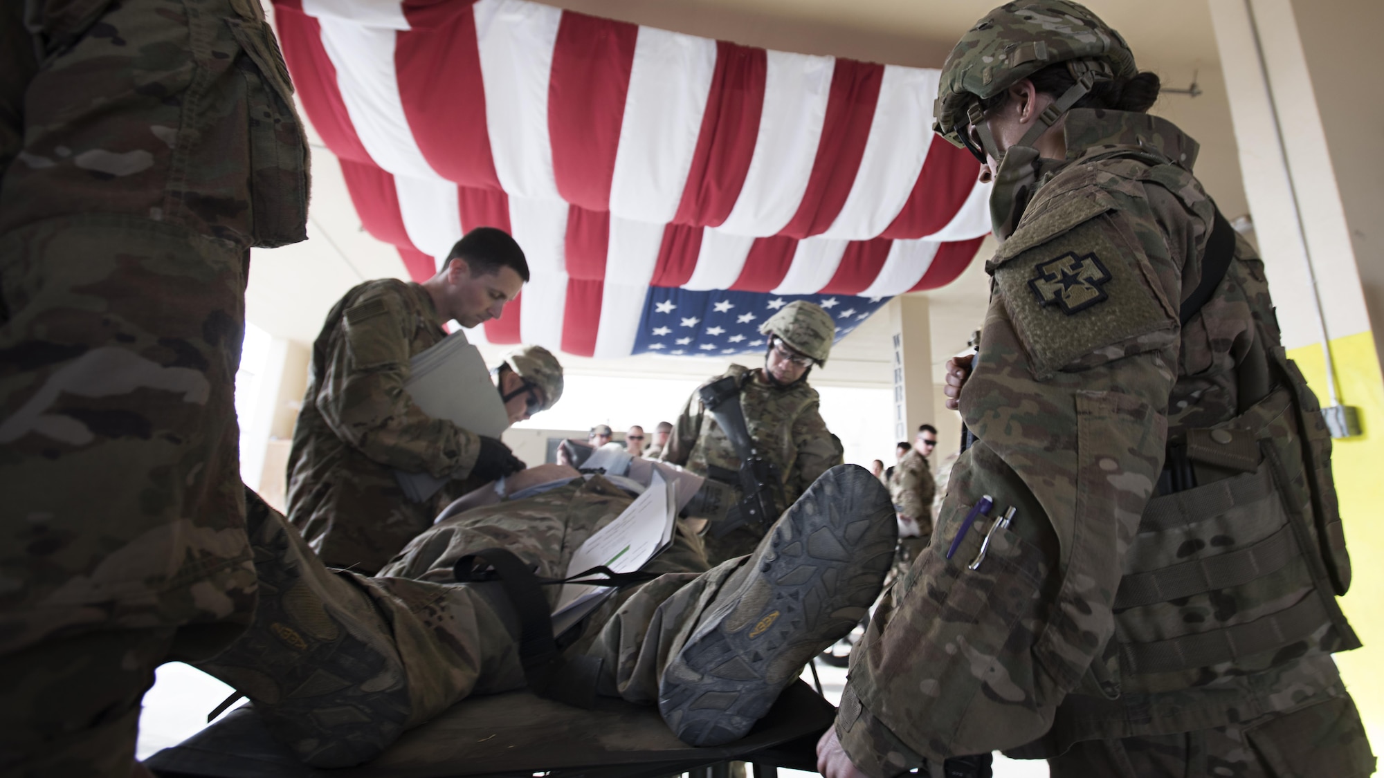 A medical response team triages a patient in “Warrior’s Way” at the Craig Joint Theater Hospital, Bagram Airfield, Afghanistan, during a mass casualty exercise Oct. 30, 2016. More than a dozen patients were treated at the hospital after a simulated improvised explosive device attack. (U.S. Air Force photo by Staff Sgt. Katherine Spessa)
