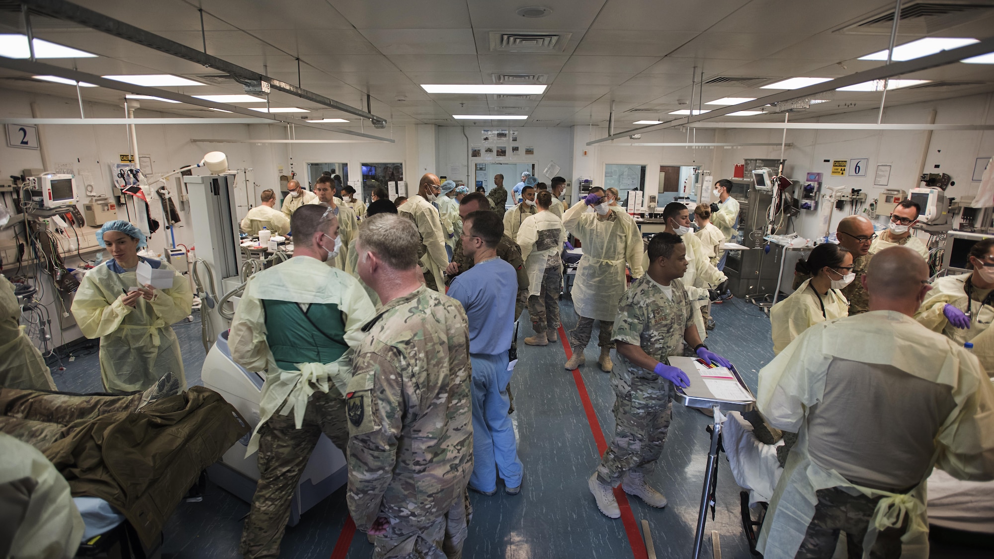 Medics treat patients in the emergency room of the Craig Joint Theater Hospital, Bagram Airfield, Afghanistan, during a mass casualty exercise Oct. 30, 2016. The exercise comes at the beginning of a new rotation of deployed medics. (U.S. Air Force photo by Staff Sgt. Katherine Spessa)
