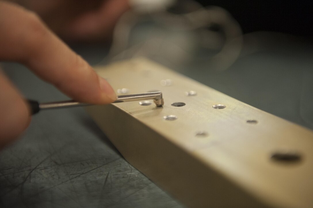 U.S. Air Force Senior Airman David Situ, 7th Equipment Maintenance Squadron nondestructive inspection journeyman, uses an eddy current to inspect a metal part at Dyess Air Force Base, Texas, Oct. 24, 2016. An eddy current causes a localized electric current wherever a component is being inspected. Even if there are cracks invisible to the naked eye, the reader can pinpoint them. (U.S. Air Force photo by Airman 1st Class Rebecca Van Syoc)