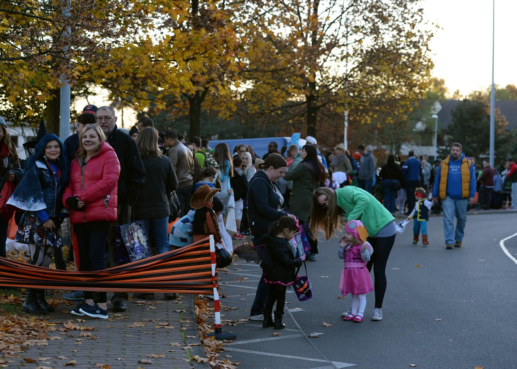 Members of the Kaiserslautern Military Community line up in preparation for the Trunk or Treat event to start at Ramstein Air Base, Germany, Oct. 31, 2016. The event gave families the opportunity to trick or treat and experience the holiday in a safe environment. (U.S. Air Force photo by Senior Airman Jimmie D. Pike)