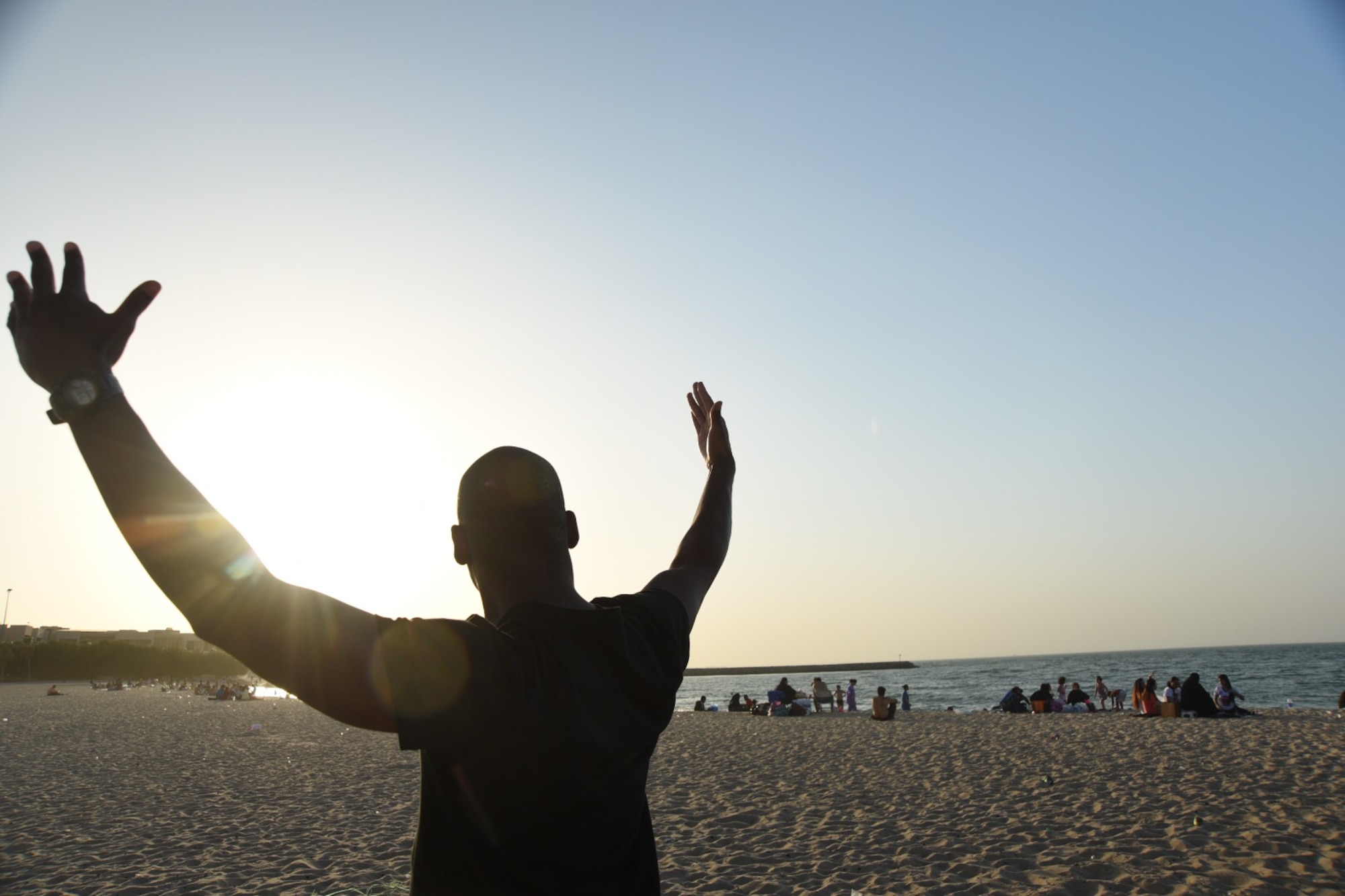 Airman 1st Class Jacoby Clay, a force protection member assigned to the 406th Civil Engineer Squadron, takes in the beauty of the beach on the coast of Kuwait City, May 14, 2016. This was the first time leaving base for many Airmen and they took full advantage of it by spending time at the beach unwinding from work duties. (U.S. Air Force photo by Airman 1st Class James L. Miller)