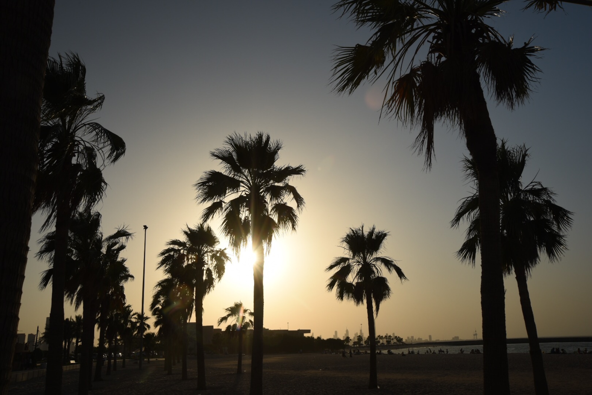 The sun begins to set on the Persian Gulf in Kuwait City, May 14, 2016. Some days after work hours, service members participated in morale trips to Kuwait City to get a taste of the Middle Eastern culture. (U.S. Air Force photo by Airman 1st Class James L. Miller)