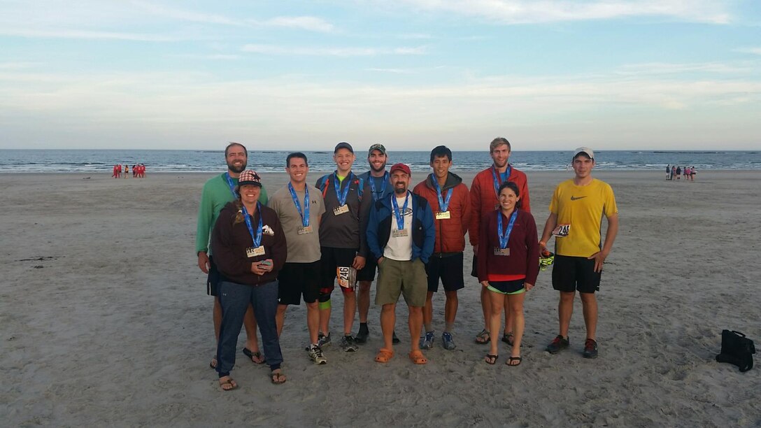 A U.S. Army Engineer Research and Development Center’s Cold Regions Research and Engineering Laboratory team recently ran a relay from the White Mountains to the coast of New Hampshire, covering a distance of approximately 200 miles. The team, participating in the Reebok Ragnar Reach The Beach Relay, battled sore legs and sleep deprivation running 203 miles, covering the distance in 27 hours, 42 minutes finishing 60th out of a total 475 teams participating.
In photo, (L to R):  CRREL team members that reached the beach recently as part of a relay event include Jared Oren, Zoe Courville, Loren Wehmeyer, Chris LeGrand (husband of CRREL researcher), Brendan West, Dan Breton, Arnold Song, Garrett Hoch, Julie Parno, Matt Parno and Sandra Jones (not pictured).