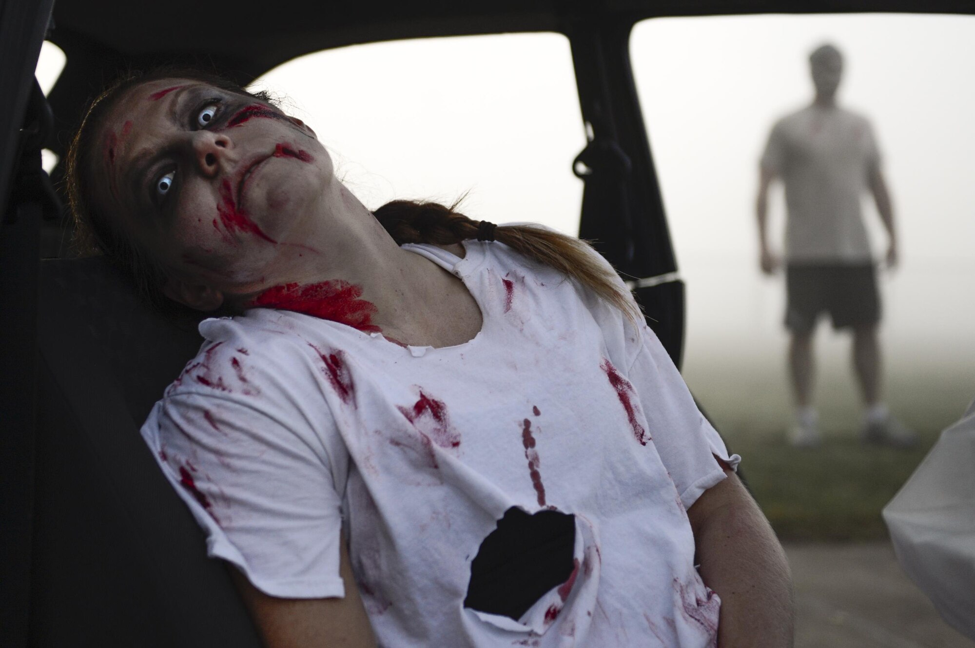 Zombies wait for Airmen and their families during the Zombie Run at Royal Air Force Lakenheath, England, Oct. 31. Zombies were seen arising from various locations across the installation. (U.S. Air Force photo/Senior Airman Malcolm Mayfield) 