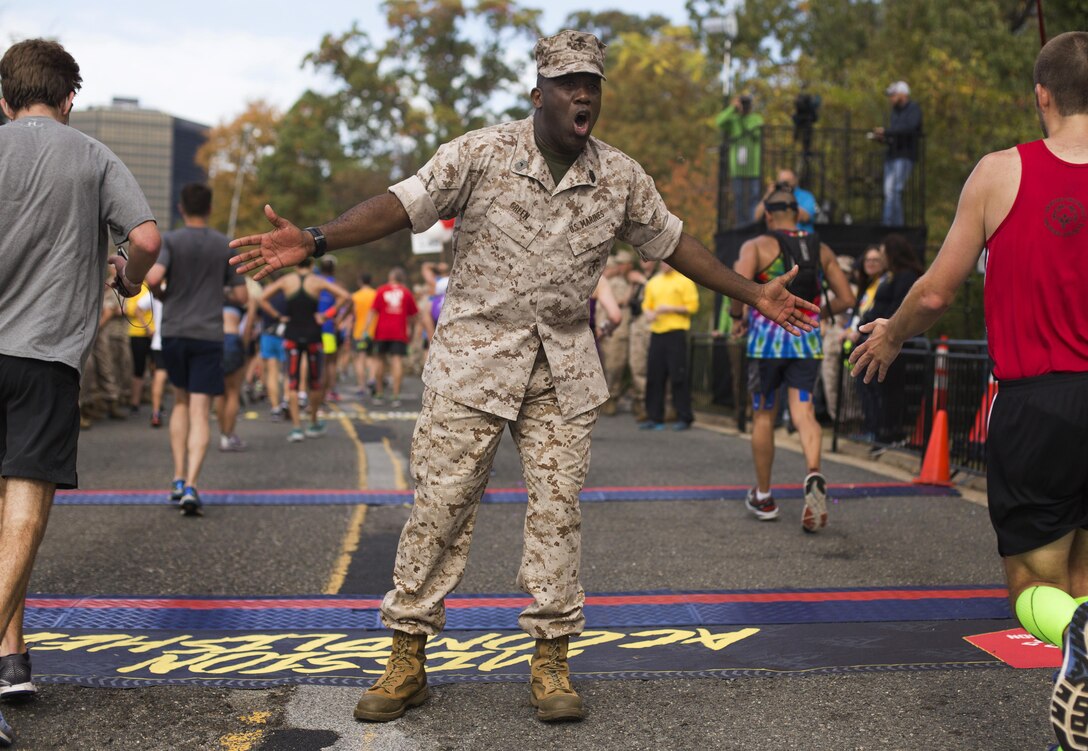 Sgt. Maj. of the Marine Corps Ronald L. Green, cheers-on participants at the 41st Marine Corps Marathon in Washington, D.C., Oct. 30, 2016. Marine Corps photo by Lance Cpl. Dana Beesley