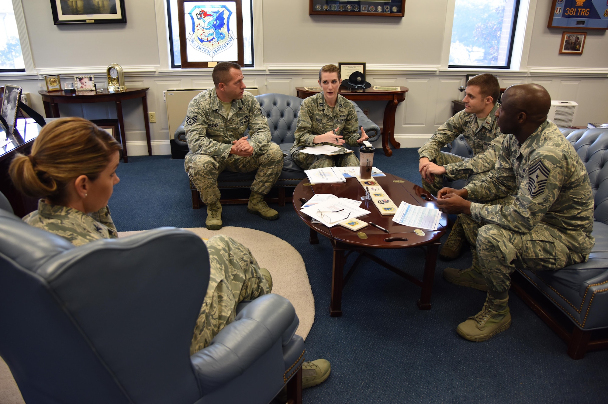 Staff Sgt. Eric Dasher, 335th Training Squadron precision measurement and equipment laboratory basic course instructor, attends a meeting with 81st Training Wing leadership at the 81st TRW headquarters building Nov. 1, 2016, on Keesler Air Force Base, Miss. Dasher participated in the new Command Chief for a Day program which highlights outstanding enlisted performers from around the wing. Each Airman selected for the program will spend the day shadowing Clark to learn what it takes to be a command chief. (U.S. Air Force photo by Kemberly Groue/Released)