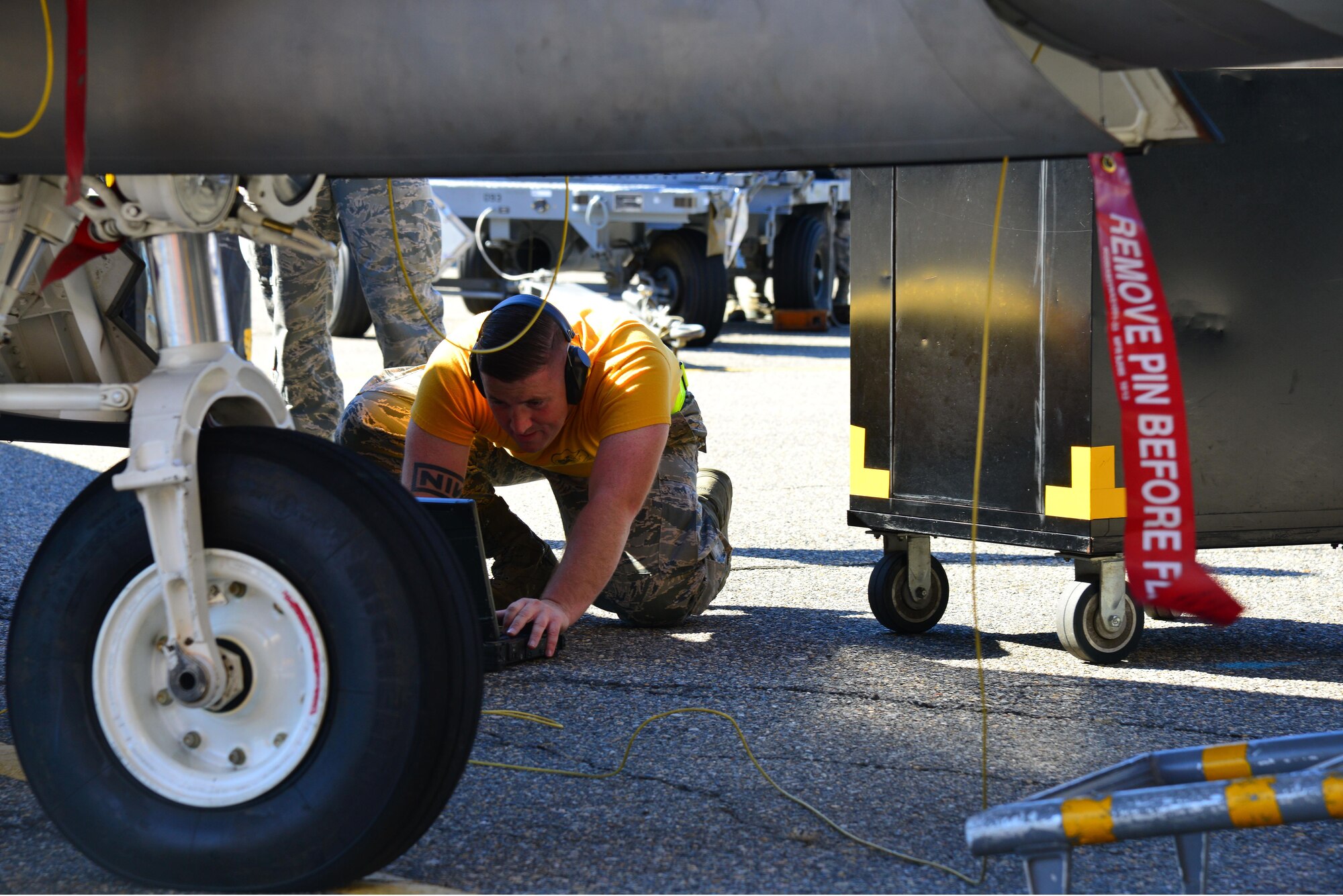 U.S. Air Force Staff Sgt. Samuel Lewis, 27th Aircraft Maintenance Unit armament technician, fills out the loading checklist during the 1st Maintenance Squadron Weapons Load Crew of the Quarter competition at Joint Base Langley-Eustis, Va., Oct. 28, 2016. Weapons Standardization evaluates the crews while they compete. The crew with the least amount of discrepancies and fastest time wins. (U.S. Air Force photo by Airman 1st Class Tristan Biese)