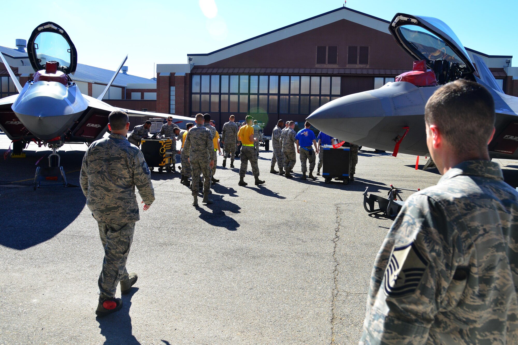 The audience congratulates teams after the 1st Maintenance Squadron Weapons Load Crew of the Quarter competition at Joint Base Langley-Eustis, Va., Oct. 28, 2016. The winner of this quarter’s competition was the 27th Aircraft Maintenance Unit. (U.S. Air Force photo by Airman 1st Class Tristan Biese)