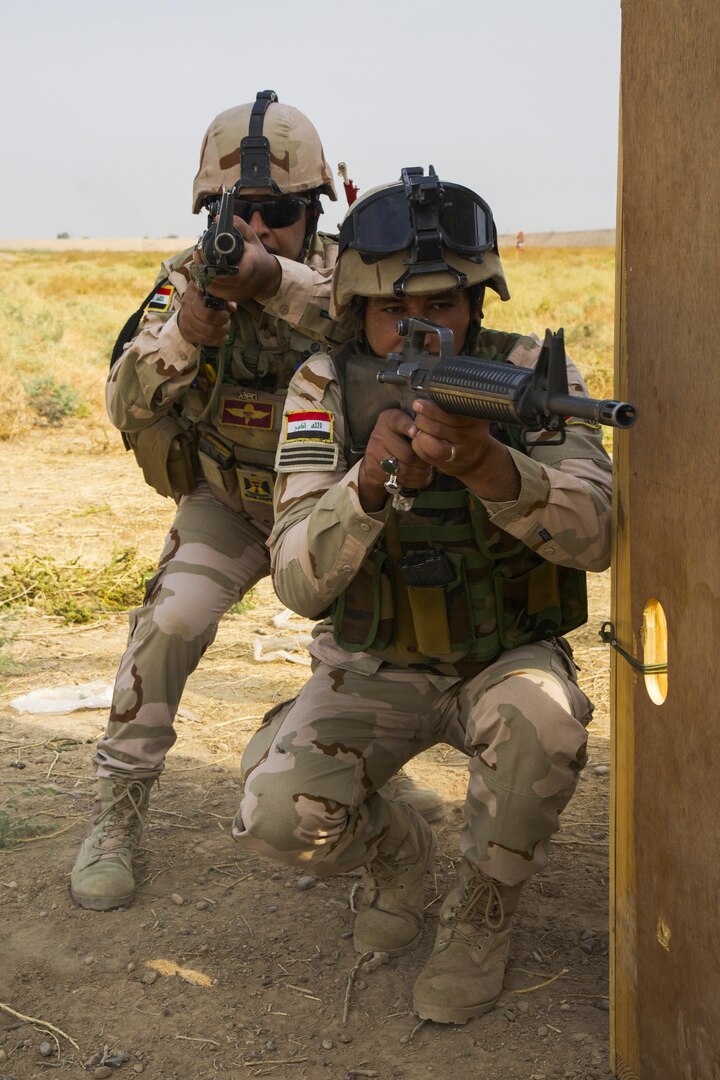 Iraqi soldiers attending Iraqi Noncommissioned Officer Academy clear a corner during urban-combat training at Camp Taji, Iraq, Oct. 22, 2016. This training is critical to enabling the Iraqi security forces to counter ISIL as they work to regain territory from the terrorist group. (U.S. Army photo by Spc. Craig Jensen)