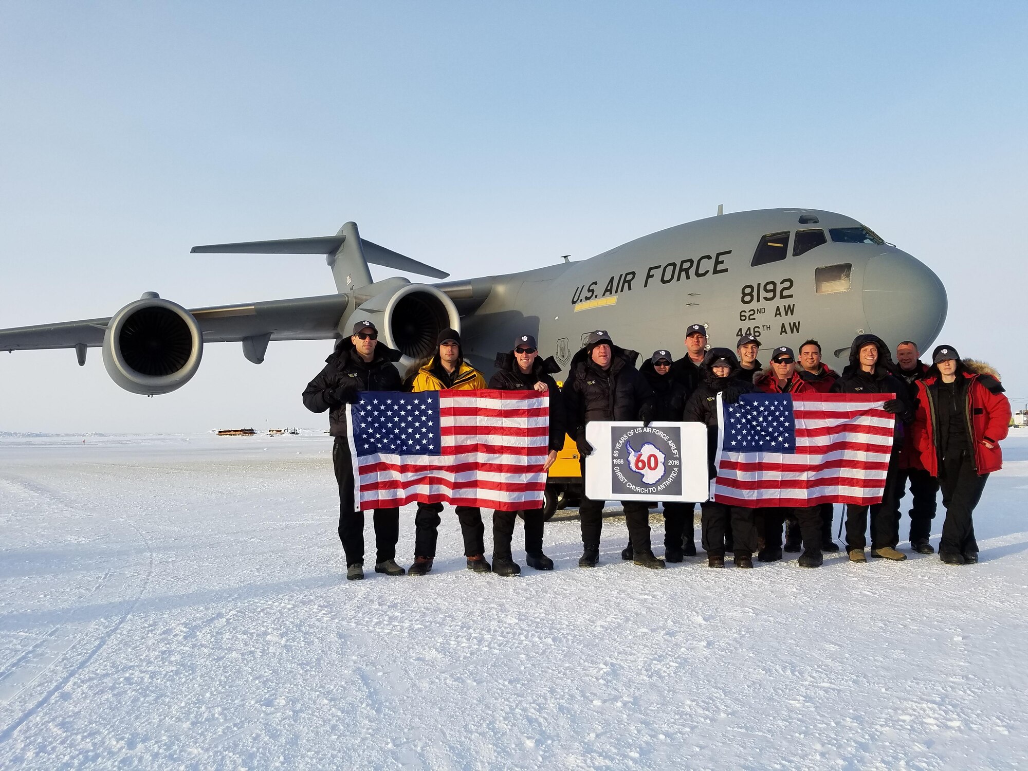 The crewmembers of “ICE12” and Team McChord Airmen display the U.S. flag Oct. 21, 2016, at McMurdo Station, Antarctica. ICE12 commemorated the first ever Air Force Antarctic flight flown 60 years ago. (Courtesy photo) 
