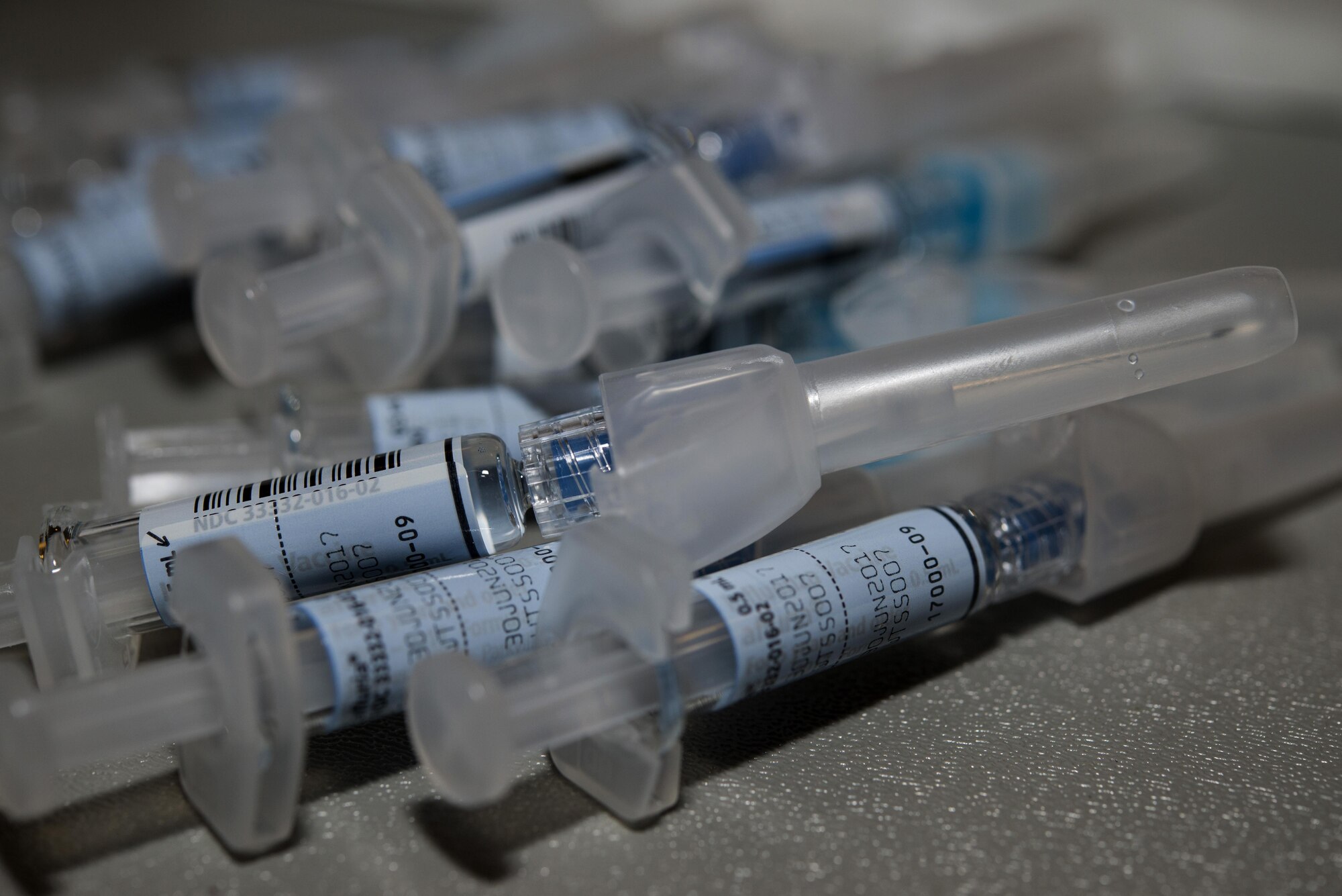 Flu vaccine syringes sit ready for use during a 436th Medical Group Point of Distribution Exercise Oct. 25, 2016, at the Landings on Dover Air Force Base, Del. The vaccination event was held in conjunction with the 436th Airlift Wing’s week-long major accident response exercise. (U.S. Air Force photo by Senior Airman Aaron J. Jenne)