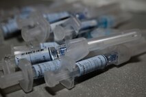 Flu vaccine syringes sit ready for use during a 436th Medical Group Point of Distribution Exercise Oct. 25, 2016, at the Landings on Dover Air Force Base, Del. The vaccination event was held in conjunction with the 436th Airlift Wing’s week-long major accident response exercise. (U.S. Air Force photo by Senior Airman Aaron J. Jenne)