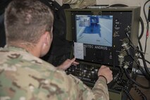 Senior Airman Joel Miller, 436th Civil Engineer Squadron explosives ordnance disposal journeyman, operates an F-6 EOD robot during a simulated radiological attack Oct. 26, 2016, at the south gate of Dover Air Force Base, Del. The simulated attack was the capstone event of a three-day Force Protection and Major Accident Response Exercise held Oct. 24 – 26. (U.S. Air Force photo by Senior Airman Aaron J. Jenne)