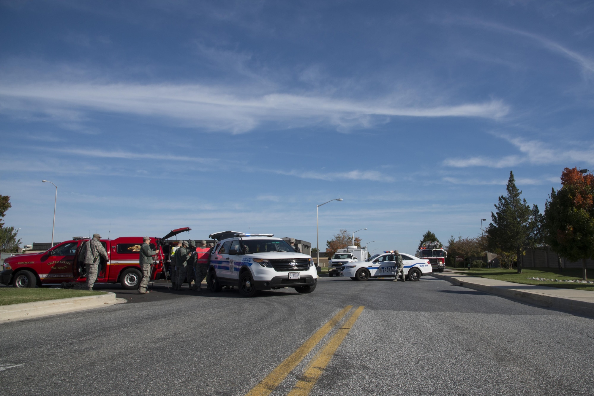 Team Dover emergency responders maintain a cordon around a simulated suspected vehicle-borne radiological device Oct. 26, 2016, near the south gate of Dover Air Force Base, Del. The incident commander coordinated the response of all 436th Airlift Wing emergency response units to safely investigate the suspected threat. (U.S. Air Force photo by Senior Airman Aaron J. Jenne)