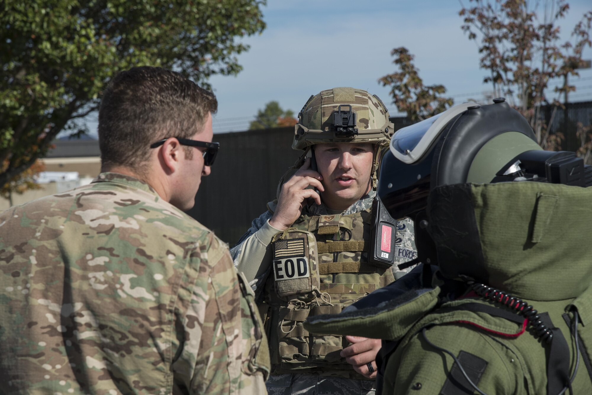 Staff Sgt. William Spencer, 436th Civil Engineer Squadron explosive ordnance disposal journeyman, coordinates the EOD investigation of a simulated suspected vehicle borne radiological device Oct. 26, 2016, at the south gate on Dover Air Force Base, Del. Airmen participating in the exercise were evaluated on procedural knowledge and adherence as well as teamwork and effectiveness. (U.S. Air Force photo by Senior Airman Aaron J. Jenne)