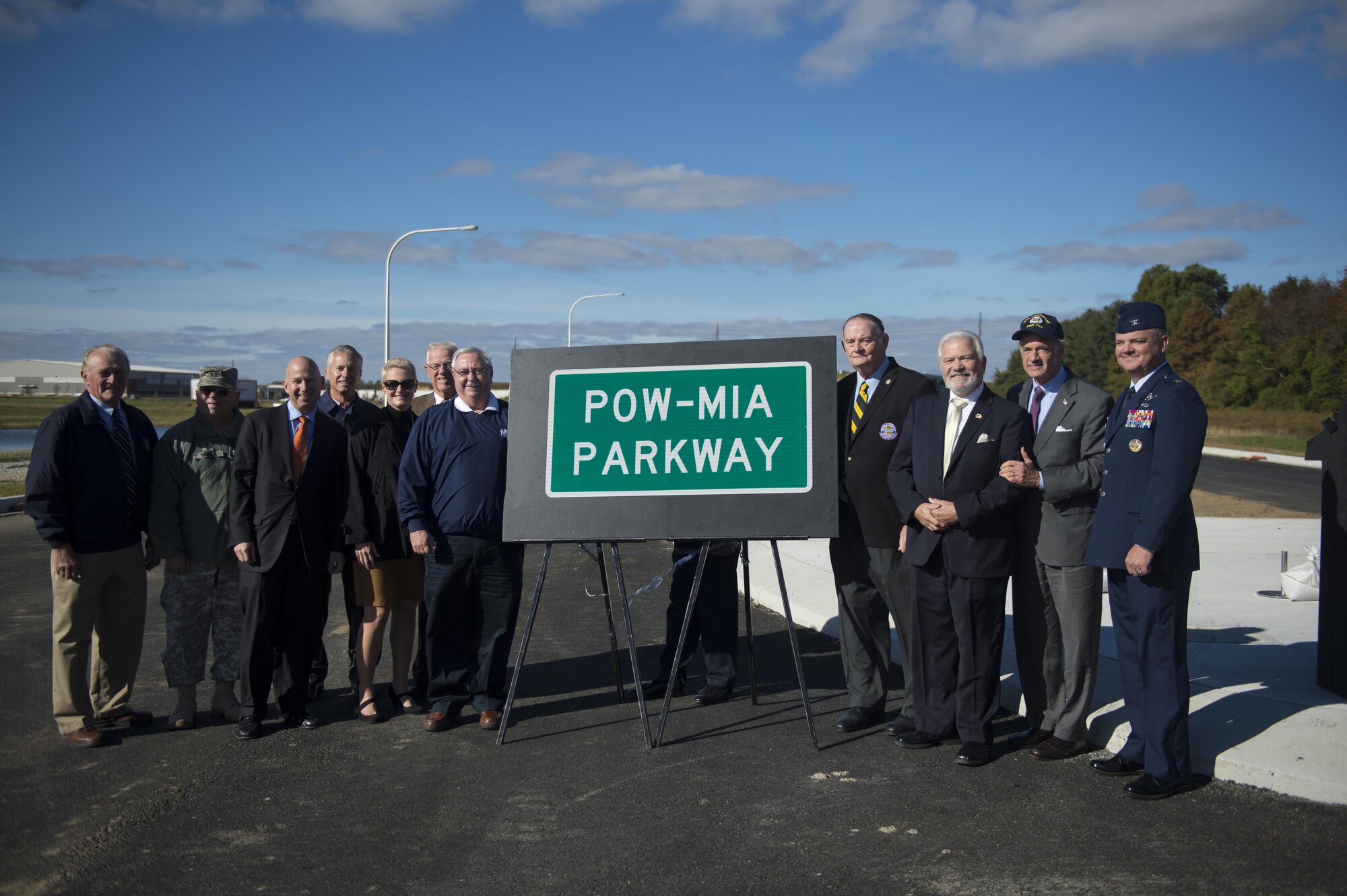 Col. Scott "Bull" Durham, 512th Airlift Wing commander, gives remarks at a POW/MIA sign unveiling ceremony to recognize members of the military from past conflicts who have not made it home yet. The 35-minute ceremony revealed the formerly known West Dover Connector’s path for motorists, pedestrians and bicyclists traveling from U.S. 13 in south Dover to Del. 15 on the city’s western side near the Eden Hill Commercial Center. (U.S. Air Force photo/Capt. Bernie Kale)