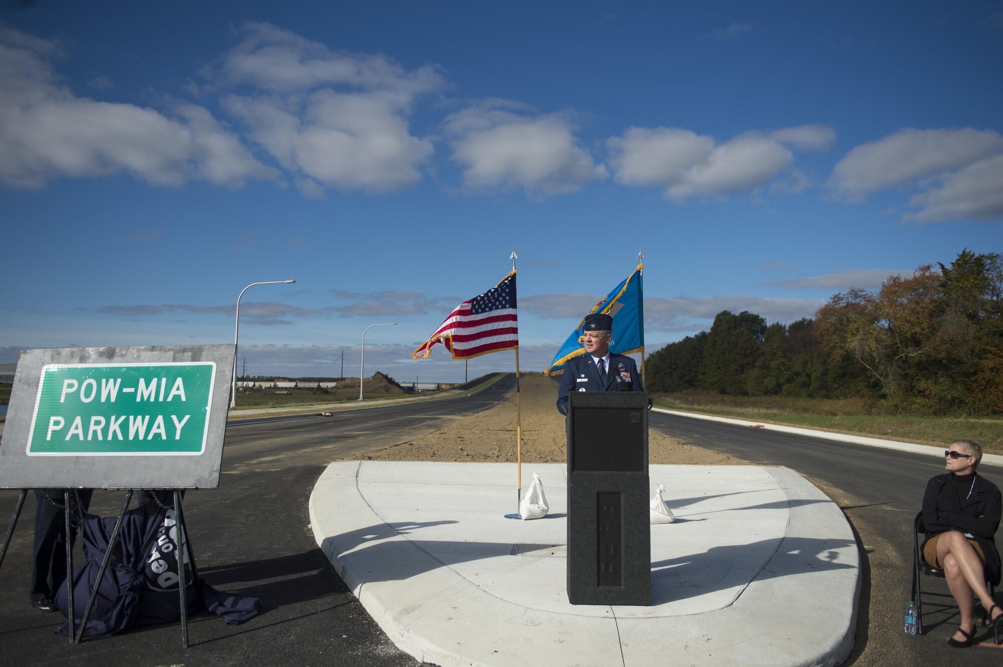 Col. Scott "Bull" Durham, 512th Airlift Wing commander, gives remarks at a POW/MIA sign unveiling ceremony to recognize members of the military from past conflicts who have not made it home yet. The 35-minute ceremony revealed the formerly known West Dover Connector’s path for motorists, pedestrians and bicyclists traveling from U.S. 13 in south Dover to Del. 15 on the city’s western side near the Eden Hill Commercial Center. (U.S. Air Force photo/Capt. Bernie Kale)