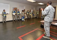 Tech. Sgt. Marcus Thompson, 628th Security Forces Squadron flight chief, briefs Pumpkin Patrol volunteers on their duties during Pumpkin Patrol here, Oct. 31, 2016. On Halloween, members of Joint Base Charleston volunteered for Pumpkin Patrol to walk through base housing on the lookout for injured or lost children.