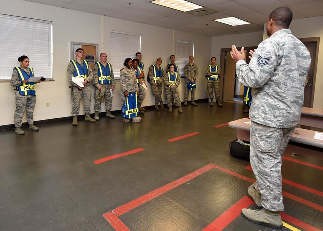 Tech. Sgt. Marcus Thompson, 628th Security Forces Squadron flight chief, briefs Pumpkin Patrol volunteers on their duties during Pumpkin Patrol here, Oct. 31, 2016. On Halloween, members of Joint Base Charleston volunteered for Pumpkin Patrol to walk through base housing on the lookout for injured or lost children.