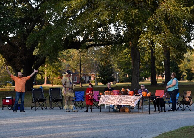 Joint Base Charleston leadership hands out candy during Pumpkin Patrol here, Oct. 31, 2016. On Halloween, members of Joint Base Charleston volunteered for Pumpkin Patrol to walk through base housing on the lookout for injured or lost children.