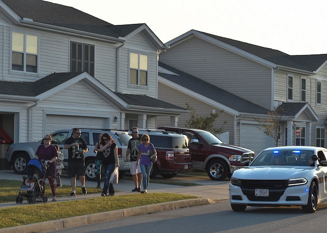 Members of the 628th Security Forces Squadron walk through Joint Base Charleston during Pumpkin Patrol, Oct. 31, 2016. On Halloween, members of Joint Base Charleston volunteered Halloween for Pumpkin Patrol to walk through base housing on the lookout for injured or lost children.