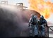 A crew of 2nd Civil Engineer firefighters prepare to enter a burning aircraft during an aircraft live fire burn at Barksdale Air Force Base, La., Oct. 26, 2016. A two-man crew consists of a nozzleman and crew chief, while a third is the instructor. (U.S. Air Force photo/Airman 1st Class Stuart Bright)