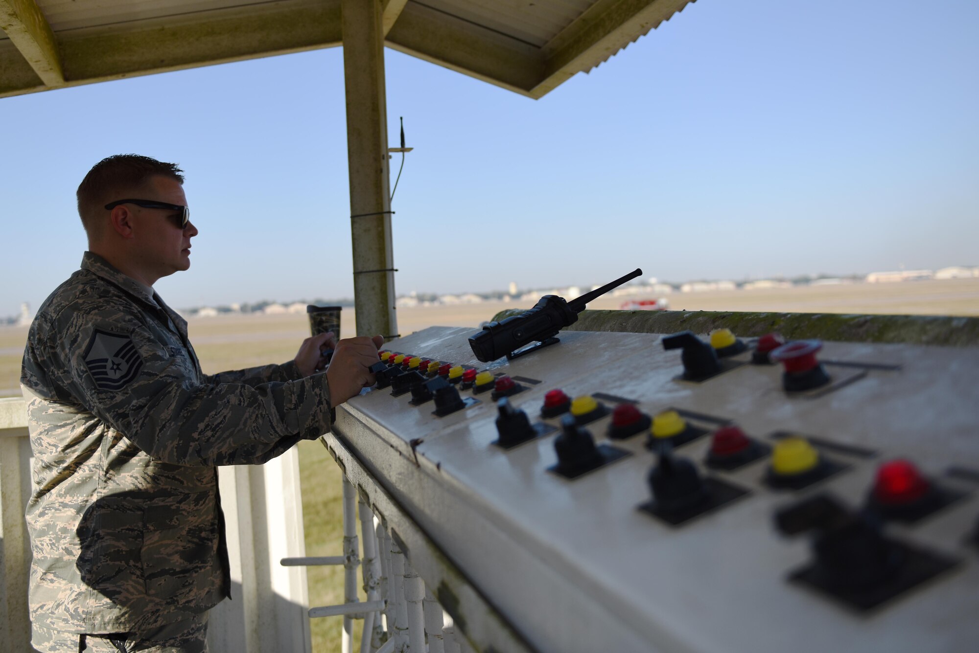 Master Sgt. Scott Strobel, 2nd Civil Engineer Squadron assistant chief of compliance, watches an aircraft live fire burn from the control tower at Barksdale Air Force Base, La., Oct. 27, 2016. Strobel controlled what areas of the aircraft were ignited and when. (U.S. Air Force photo/Airman Alexis C. Schultz)