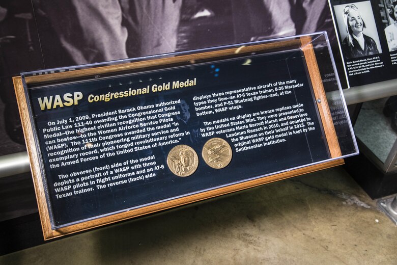 DAYTON, Ohio -- On July 1, 2009, President Barack Obama authorized Public Law 111-40 awarding the Congressional Gold Medal-the highest civilian recognition that Congress can bestow-to the Women Airforce Service Pilots(WASP). The 111th Congress awarded the medal "In recognition of their pioneering military service and exemplary record, which forged revolutionary reform in the Armed Forces of the United States of America." The medals on display are bronze replicas made by the U.S. Mint. They were presented to WASP veterans Marie Barrett Marsh and Genevieve Landman Rausch in 2010, and donated to the Museum on their behalf in 2015. The original WASP gold medal is kept by the Smithsonian Institution. (U.S. Air Force photo by Ken LaRock)