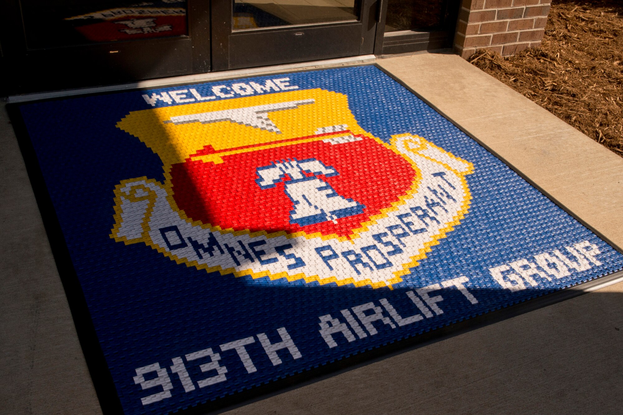 A new welcome mat graces the entrance for the 913th Airlift Group campus at Little Rock Air Force Base, Ark., Oct. 31, 2016. Key 913 AG offices, from several locations around Little Rock AFB, have been consolidating into the newly remodeled building. Moving into the new campus, which is located in building 262, began on October 17, and is scheduled to be completed by November 8. (U.S. Air Force photo by Master Sgt. Jeff Walston/Released)  