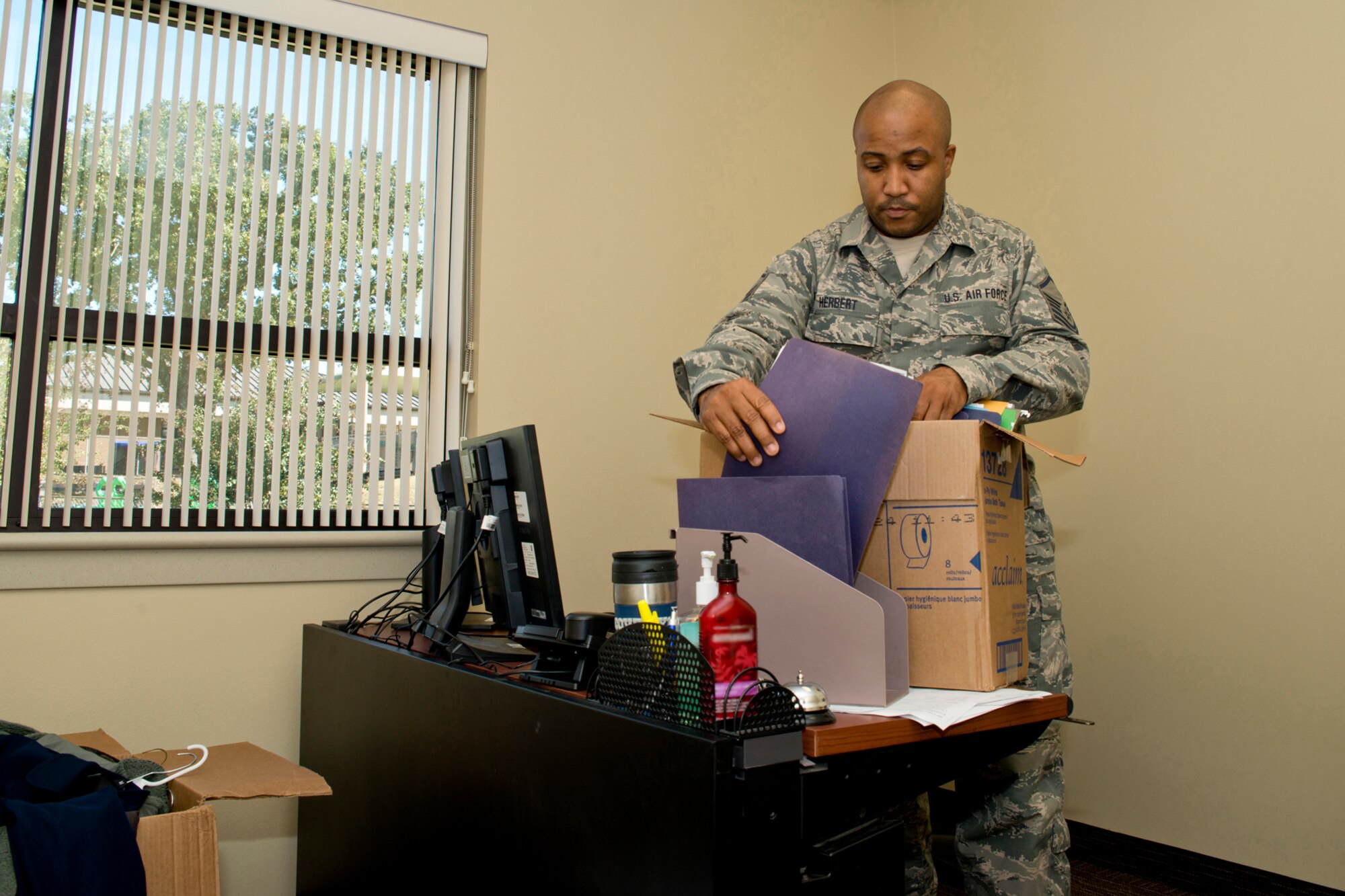 U.S. Air Force Reserve Master Sgt. Thomas Herbert, acting superintendent, 913th Aerospace Medical Squadron, unpacks in his new office at Little Rock Air Force Base, Ark., Oct. 31, 2016. Airmen assigned to the 913 AMDS will now conduct business operations in building 1995 from Monday through Friday, and will continue to see patients at the base clinic during Unit Training Assembly weekends. (U.S. Air Force photo by Master Sgt. Jeff Walston/Released)  