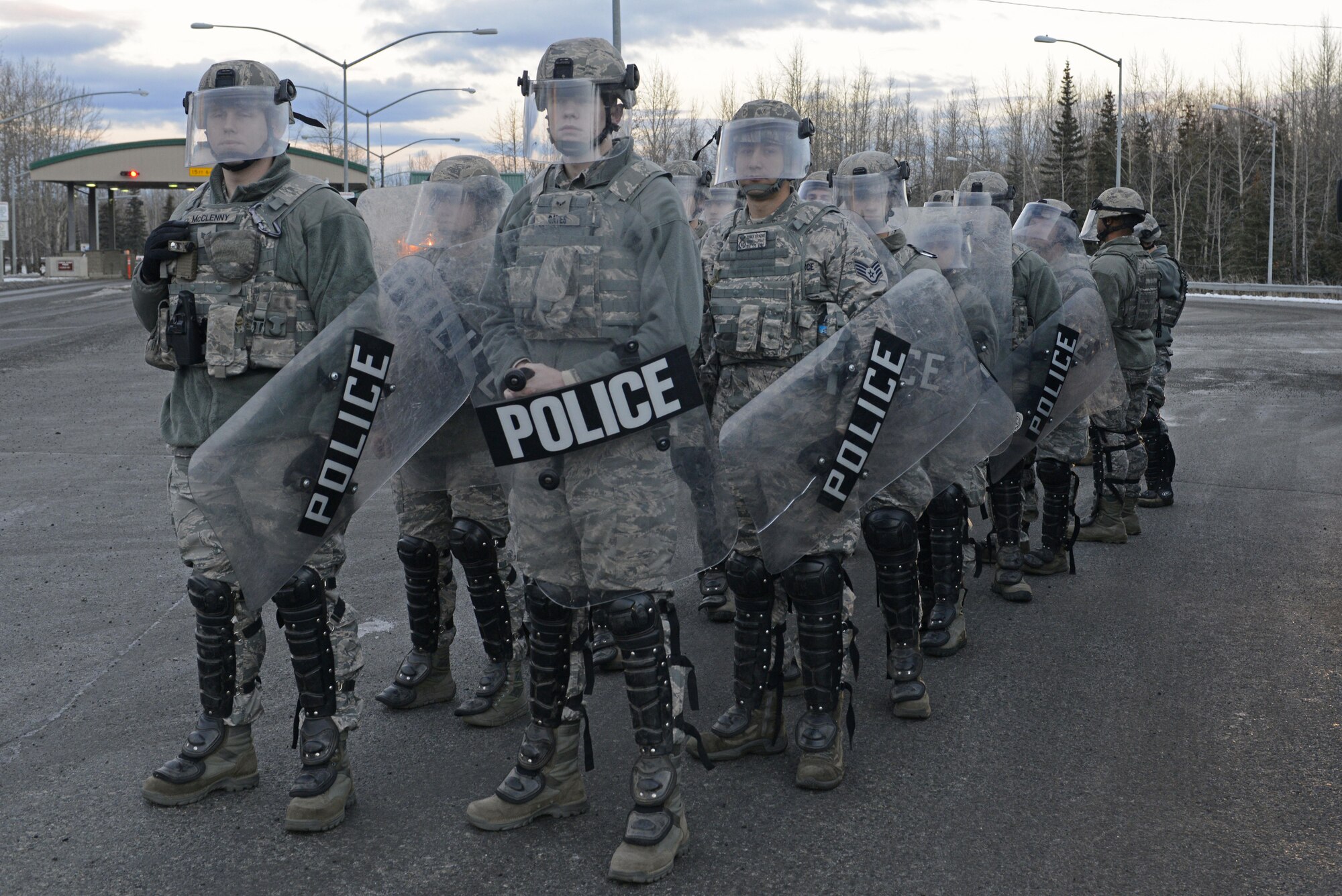 Joint Base Elmendorf-Richardson security forces personnel perform security operations during a simulated protest as part of exercise Polar Force 17-1 at JBER, Alaska, Nov. 1, 2016. The simulated protest began as a peaceful demonstration which escalated, resulting in a few aggressive protesters being detained and turned over to local law enforcement. The exercise tests the base's ability to integrate, mobilize, and prepare assigned personnel, aircraft and equipment for a wartime mission and to employ forces and weapons systems. 