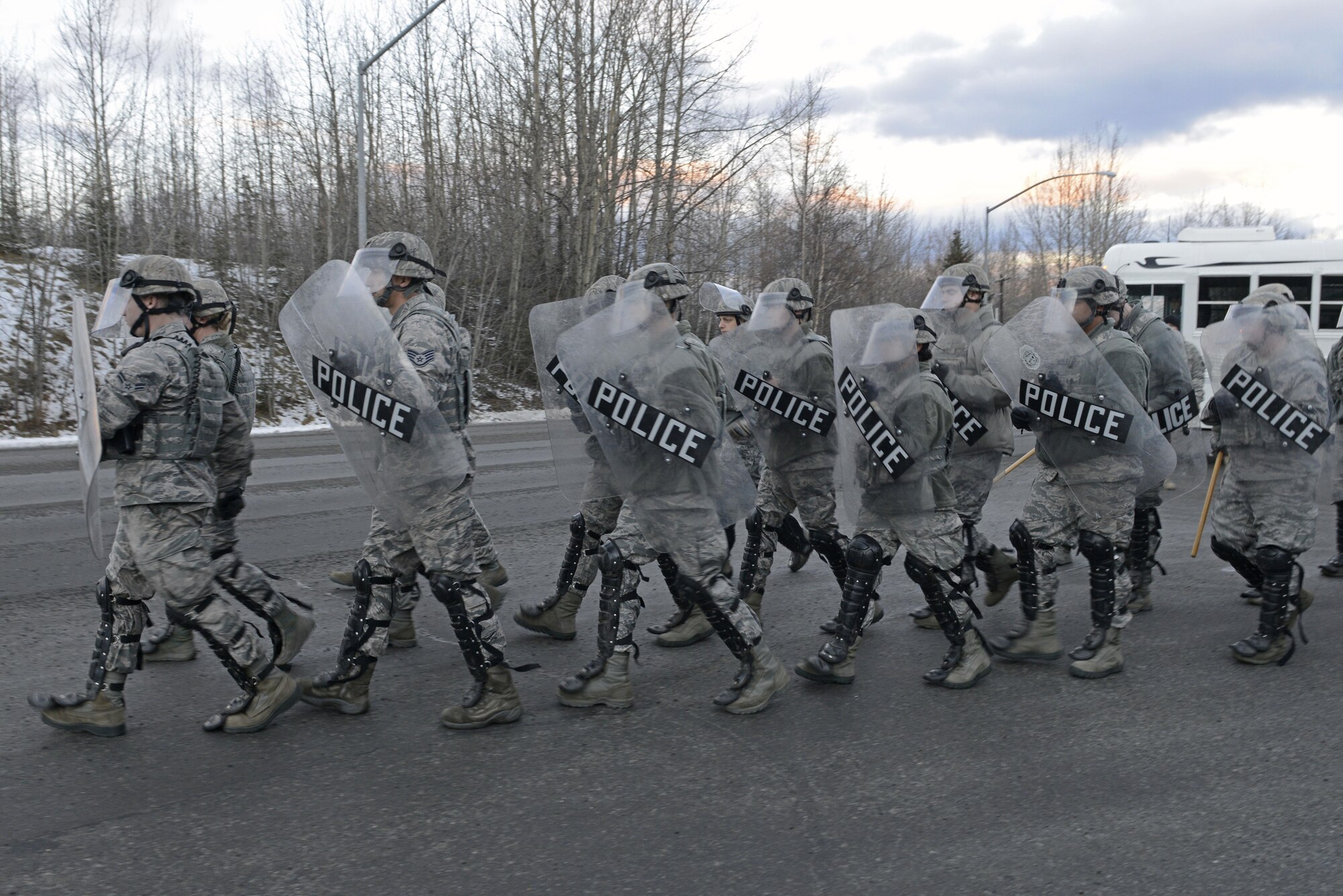Joint Base Elmendorf-Richardson security forces personnel perform security operations during a simulated protest as part of exercise Polar Force 17-1 at JBER, Alaska, Nov. 1, 2016. The simulated protest began as a peaceful demonstration which escalated, resulting in a few aggressive protesters being detained and turned over to local law enforcement. The exercise tests the base's ability to integrate, mobilize, and prepare assigned personnel, aircraft and equipment for a wartime mission and to employ forces and weapons systems. 