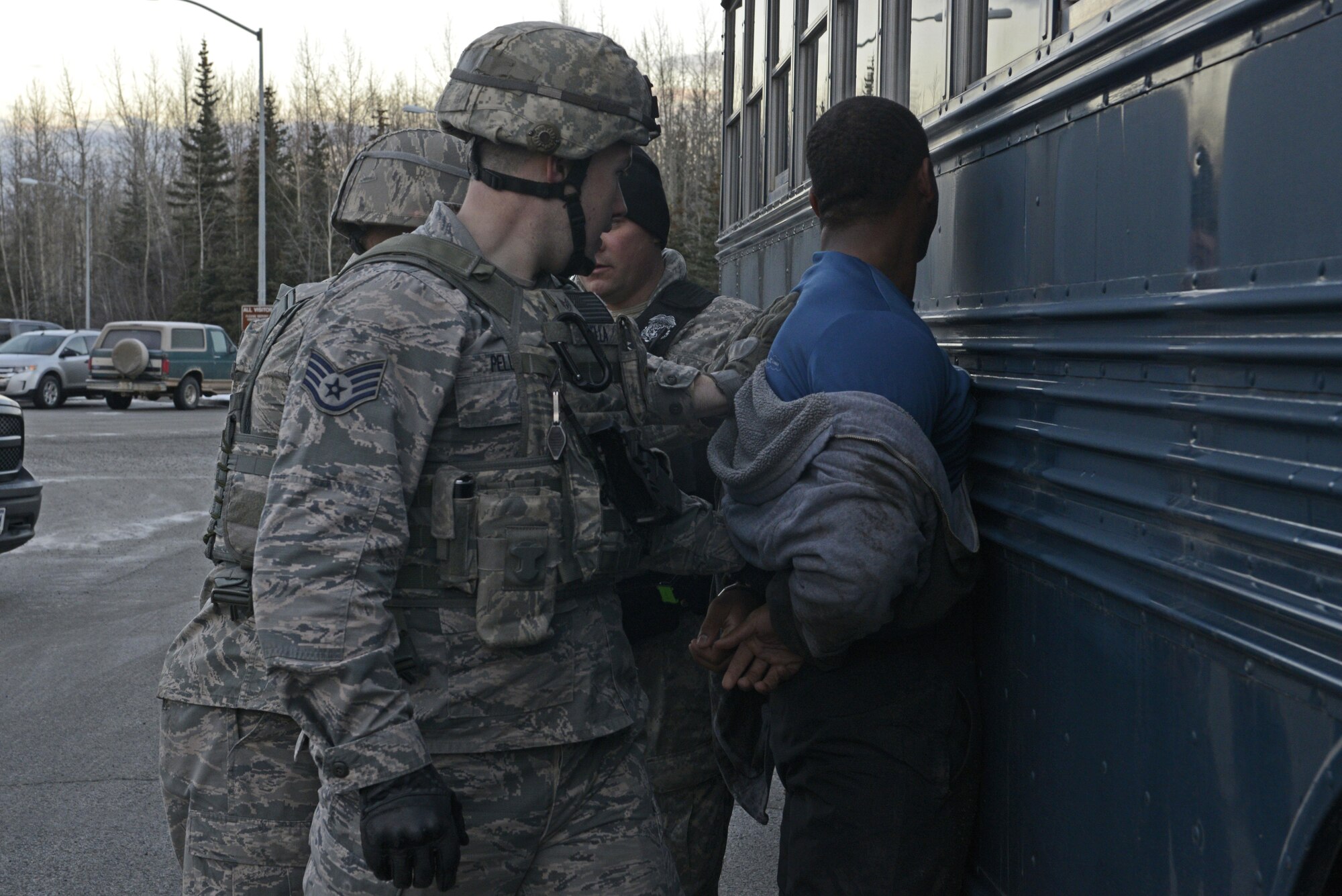 Joint Base Elmendorf-Richardson security forces personnel perform security operations during a simulated protest as part of exercise Polar Force 17-1 at JBER, Alaska, Nov. 1, 2016. The simulated protest began as a peaceful demonstration which escalated, resulting in a few aggressive protesters being detained and turned over to local law enforcement. The exercise tests the base's ability to integrate, mobilize, and prepare assigned personnel, aircraft and equipment for a wartime mission and to employ forces and weapons systems. 