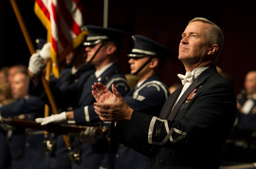 Col. Larry H. Lang, U.S. Air Force Band conductor and commander, claps at the end of a Fall 2016 Tour concert in Midland, Pa., Oct. 28, 2016. Lang was selected to command the band in 2012 and is in charge of equipping, training and deploying the 184 squadron members on approximately 1,600 missions each year. The biannual tours are part of the band’s mission to inspire patriotism and military service in the community, honor veterans and represent the U.S. throughout the world. (U.S. Air Force photo by Senior Airman Jordyn Fetter)