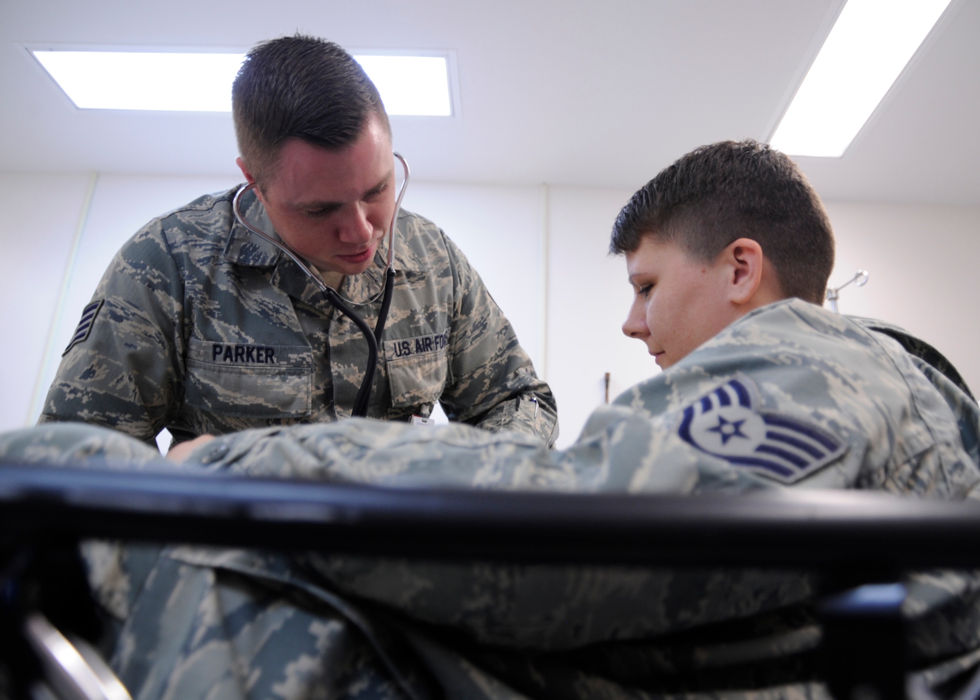 U.S. Air Force Staff Sgt. Jason Parker, 325th Aerospace Medical Squadron medical service craftsman, checks the pulse of a coworker during a training exercise in Tyndall Air Force Base medical clinic, Fla., Oct. 25, 2016. Parker was selected as an outstanding performer in the 325th AMDS by his leadership. (U.S. Air Force photo by Senior Airman Solomon Cook/Released) 