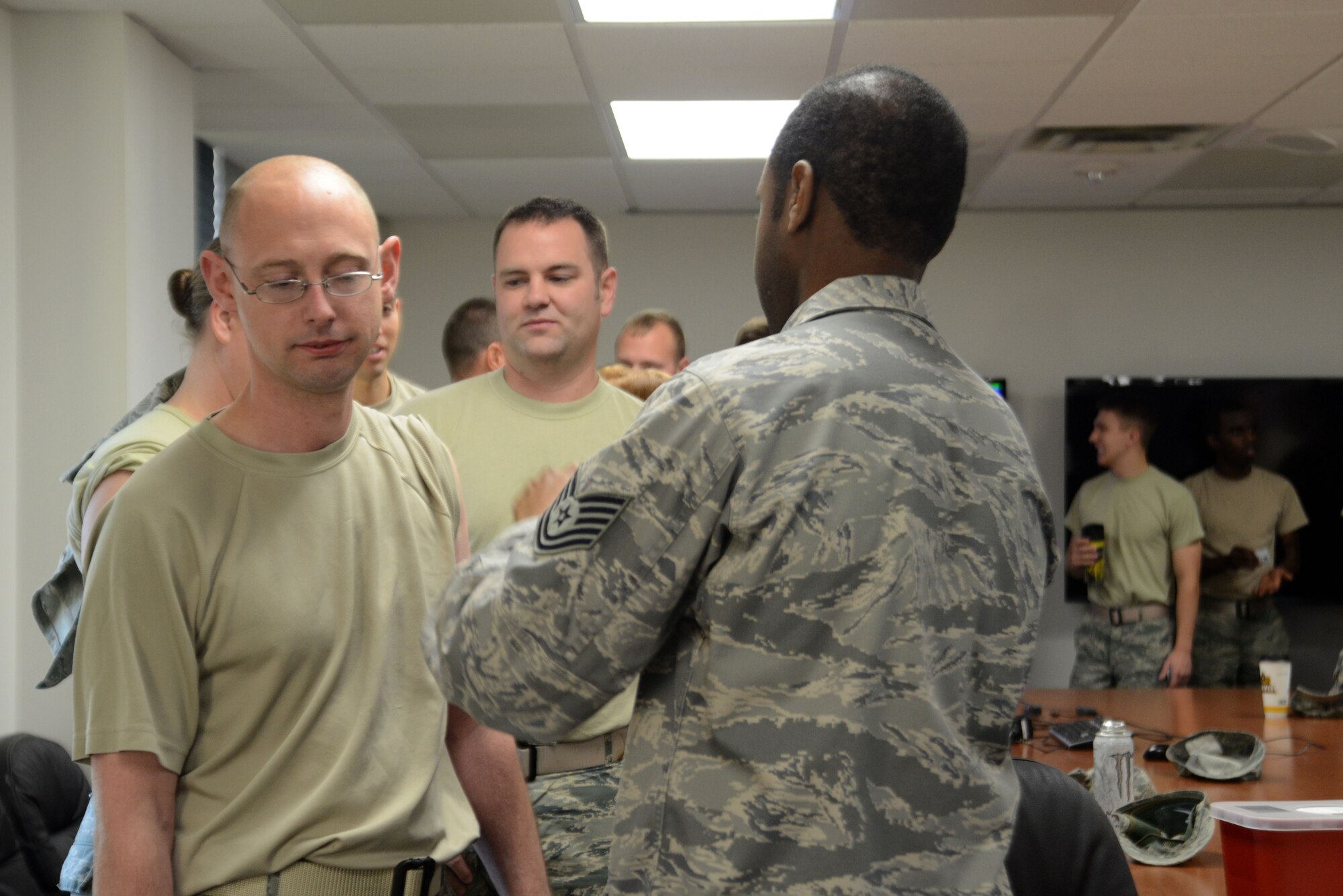 Master Sgt. Steven James, 673d Air Base Wing chaplain assistant, awaits a vaccination during a flu line at the People Center at Joint Base Elmendorf-Richardson, Alaska, Oct. 5, 2016. The flu line was an option for groups of more than 40 people to receive their influenza shot instead of going to the Allergy and Immunizations clinic.