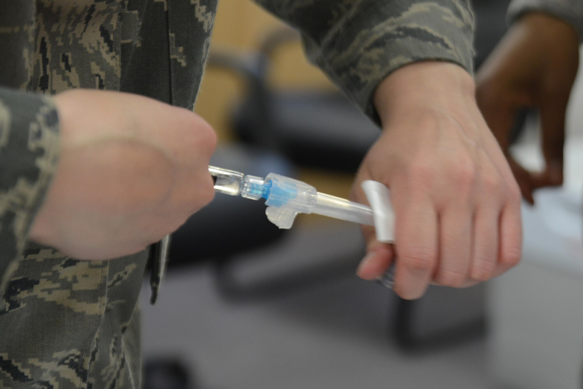 Senior Airman Casie Neiman, 673d Medical Operational Support Allergy and Immunizations backup technician, fills a syringe with flu vaccine at the People Center at Joint Base Elmendorf-Richardson, Alaska, Oct. 5, 2016. Patients receive the full benefit of the vaccine after two weeks; protection lasts for a few months. The Allergy and Immunization clinic recommended taking the influenza shot mid-October for maximum protection against the expected flu spike between January and April. 