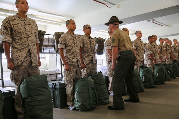 A drill instructor from Lima Company, 3rd Recruit Training Battalion, instructs a recruit to respond louder during pick up at Marine Corps Recruit Depot San Diego, Oct. 28. The recruits will spend pick up with their drill instructors learning the rules and regulations of recruit training, regarding everything from how to act in the squad bay to how to speak to drill instructors. Annually, more than 17,000 males recruited from the Western Recruiting Region are trained at MCRD San Diego. Lima Company is scheduled to graduate Jan. 20.