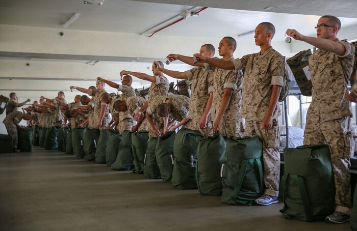 Recruits from Lima Company, 3rd Recruit Training Battalion, hold out their locks during pick up at Marine Corps Recruit Depot San Diego, Oct. 28. Recruits are expected to keep their gear secured with their locks at all times to ensure accountability. Annually, more than 17,000 males recruited from the Western Recruiting Region are trained at MCRD San Diego. Lima Company is scheduled to graduate Jan. 20.