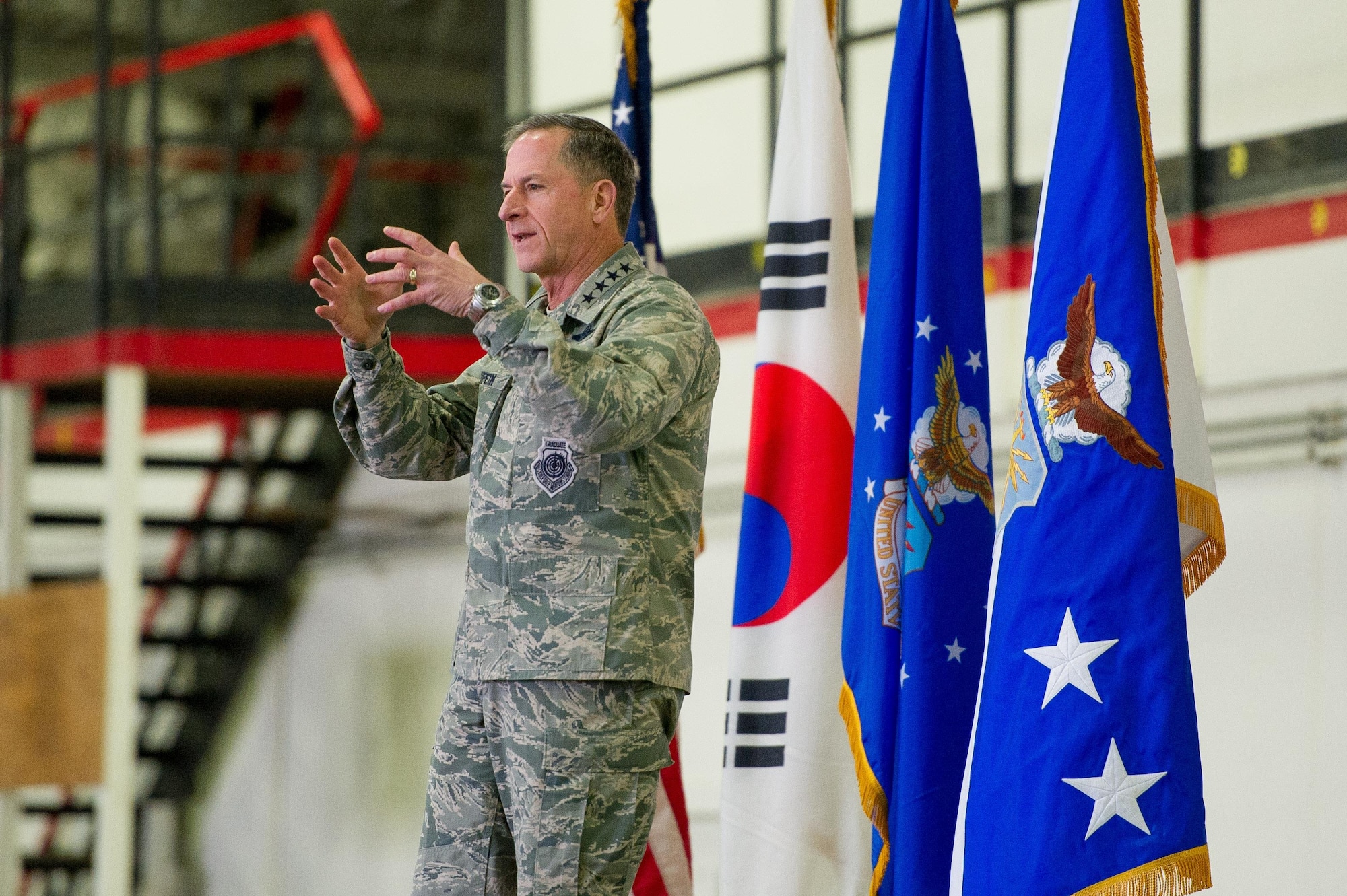Air Force Chief of Staff Gen. David L. Goldfein speaks with Team Osan during an all-call on Osan Air Base, Republic of Korea, Oct. 31 2016. While visiting the base, Goldfein shared his priorities of revitalizing squadrons, strengthening joint leaders and teams, and multi-domain command and control. (U.S. Air Force photo by Staff Sgt. Jonathan Steffen)
