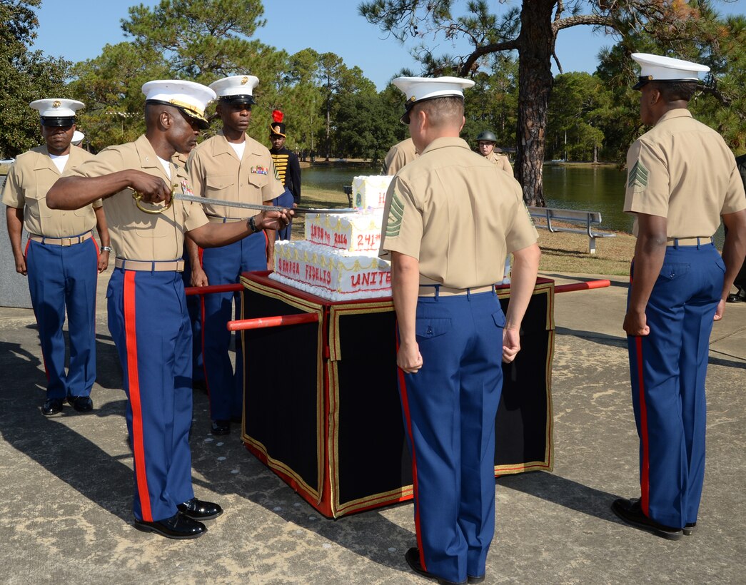 Col. James C. Carroll III, commanding officer, Marine Corps Logistics Base Albany, cuts the first piece of the Marine Corps birthday cake during a ceremony at Covella Pond, Nov. 1.