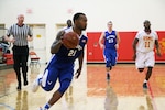 Senior Airman Daveon Allen of Nellis AFB, Nevada drives the lane during the 2016 Armed Forces Men's Basketball Championship held at MCB Quantico, Va. from 1-7 November.  Air Force won the first contest 66-62 over the Marines.  The best two teams during the doubel round robin will face each other for the 2016 Armed Forces crown.  