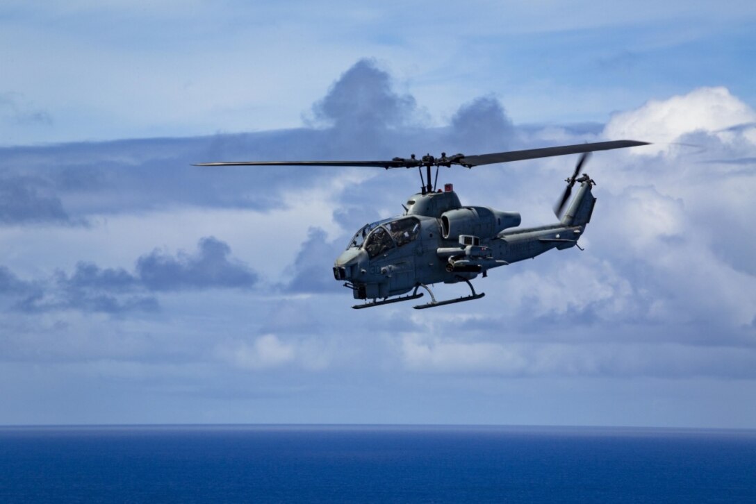 An AH-1W Super Cobra helicopter from Marine Medium Tiltrotor Squadron 262 (Reinforced), 31st Marine Expeditionary Unit, flies over the Pacific Ocean during a fire support training exercise, Sept. 16, 2016. As the Marine Corps’ only continuously forward deployed unit, the 31st Marine Expeditionary Unit is prepared to respond to a wide range of military operations, from humanitarian assistance missions to limited combat operations, at a moment’s notice. (U.S. Marine Corps photo by Cpl. Darien J. Bjorndal/Released) 