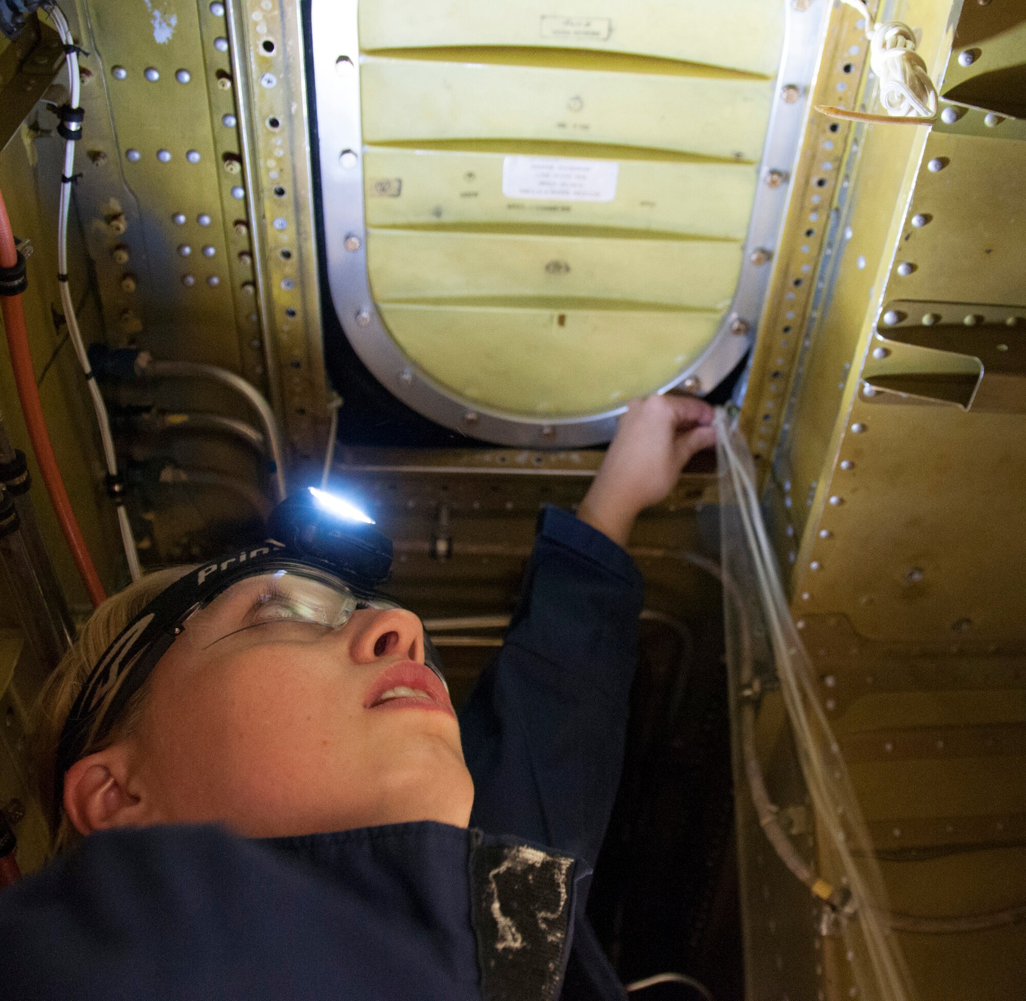 Staff Sgt. Julia Meyer, a fuels systems mechanic with the 168th Maintenance Squadron, finishes the lacing for the fuel system zero-cell access area of the KC-135R inside the unit's fuel cell hangar at Eielson AFB, Alaska, October 18, 2016. Meyer is a fulltime technician with the Interior-Alaska unit and recently returned home from her third deployment to Southwest Asia. (U.S. Air National Guard photo by Senior Master Sgt. Paul Mann/Released)