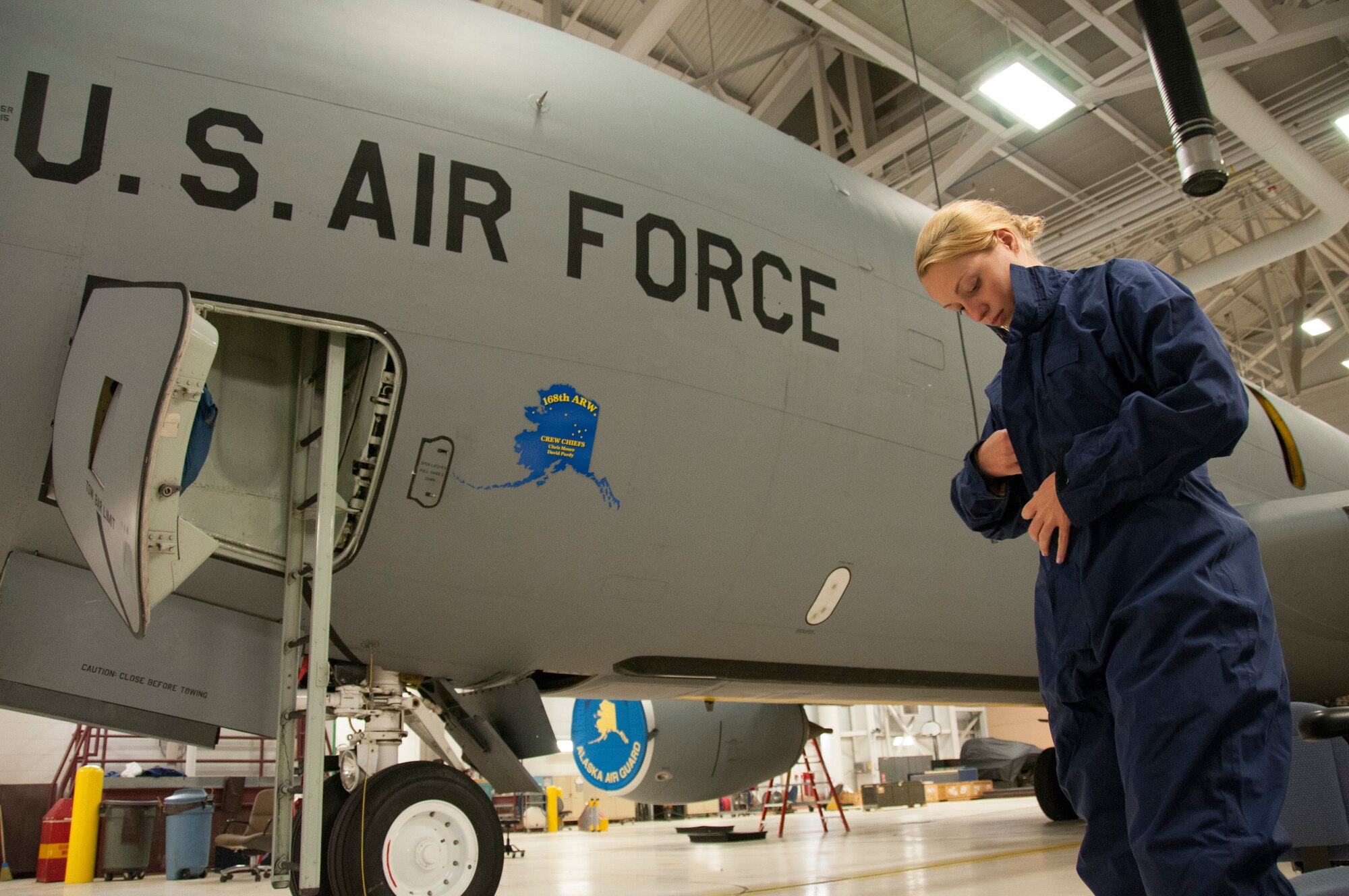 Staff Sgt. Julia Meyer, a fuels systems mechanic with the 168th Maintenance Squadron, dresses in waterproof overalls as she prepares to inspect part of the KC-135R fuel system inside the unit's fuel cell at Eielson AFB, Alaska, October 18, 2016. Meyer is a fulltime technician with the Interior-Alaska unit and recently returned home from her third deployment to Southwest Asia. (U.S. Air National Guard photo by Senior Master Sgt. Paul Mann/Released)