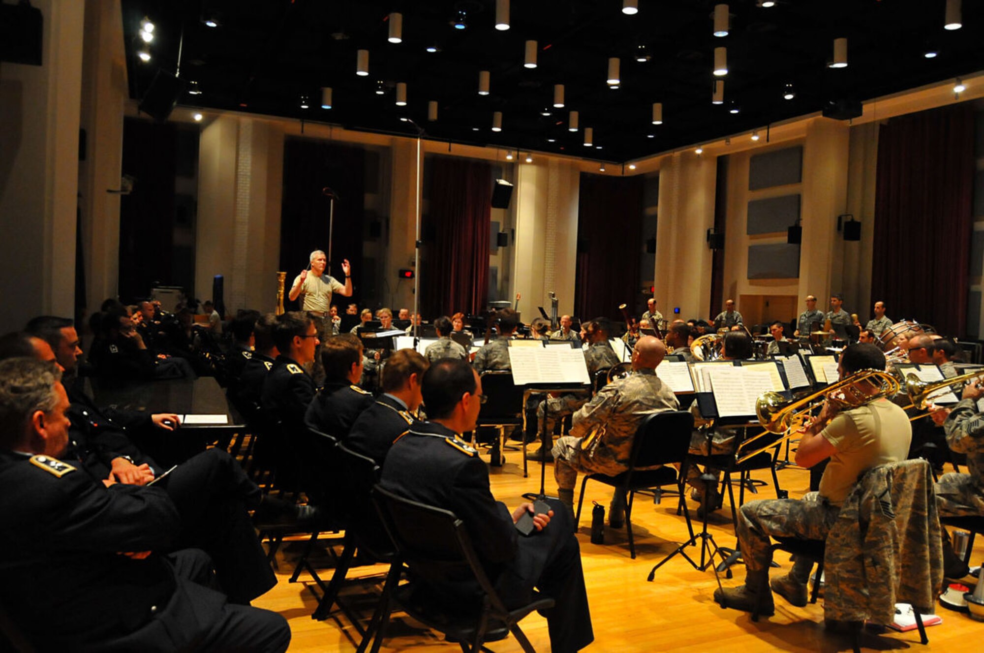 The German Air Force Band watches as the United States Air Force Concert Band practices for their upcoming shows, Sept. 28 at the USAF Band hangar. The German AF Band toured the hangar and were greeted by short performances from the Singing Sergeants, the Air Force Strings, Max Impact, and the Concert Band.