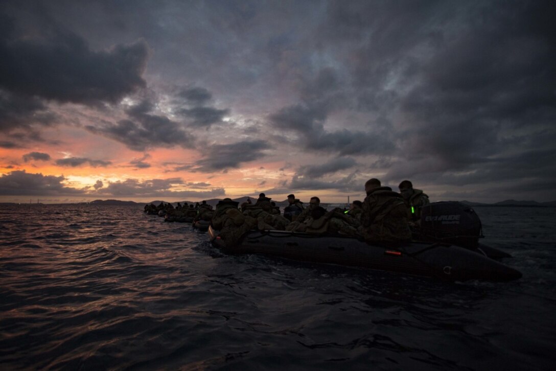 U.S. Marines assigned to Company F, Battalion Landing Team 2nd Battalion, 4th Marines, 31st Marine Expeditionary Unit, maneuver with combat rubber raiding craft while participating in an amphibious night raid off the coast of Camp Courtney, Okinawa, Japan, Sept. 3, 2016. As the Marine Corps' force-in-readiness in the Asia-Pacific region, the 31st MEU trains in a number of unique capabilities for rapid crisis response. (U.S. Marine Corps photo by Cpl. Darien J. Bjorndal, 31st Marine Expeditionary Unit/ Released)