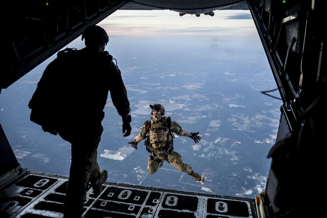 A Naval Warfare service member leaps from an Air Force MC-130 Combat Talon II during a high-altitude, low-opening jump as part of Southern Strike 17 in Gulfport, Miss., Oct. 25, 2016. The Mississippi Air National Guard’s Combat Readiness Training Center hosted the multiservice exercise, which emphasizes air-to-air, air-to-ground and special operations forces training opportunities. Air Force photo by Senior Airman Trevor T. McBride