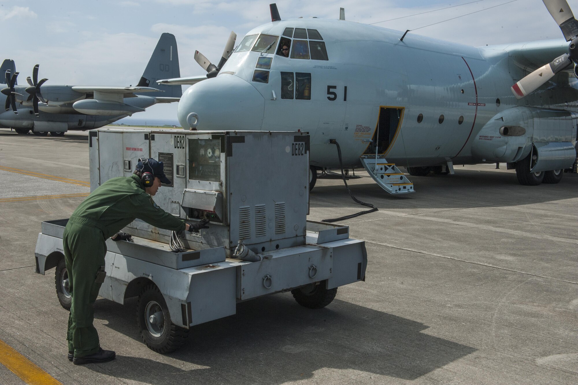 A member of the Japan Air Self-Defense Force operates a ground power unit for a JASDF C-130 Globemaster taking part in Exercise Keen Sword Oct. 30, 2016, on the flightline at Kadena Air Base, Japan. Keen Sword is a multi-phase exercise which involves multiple bases and branches from across the Indo-Asian Pacific Theater. (U.S. Air Force photo by Airman 1st Class Nick Emerick /Released) 